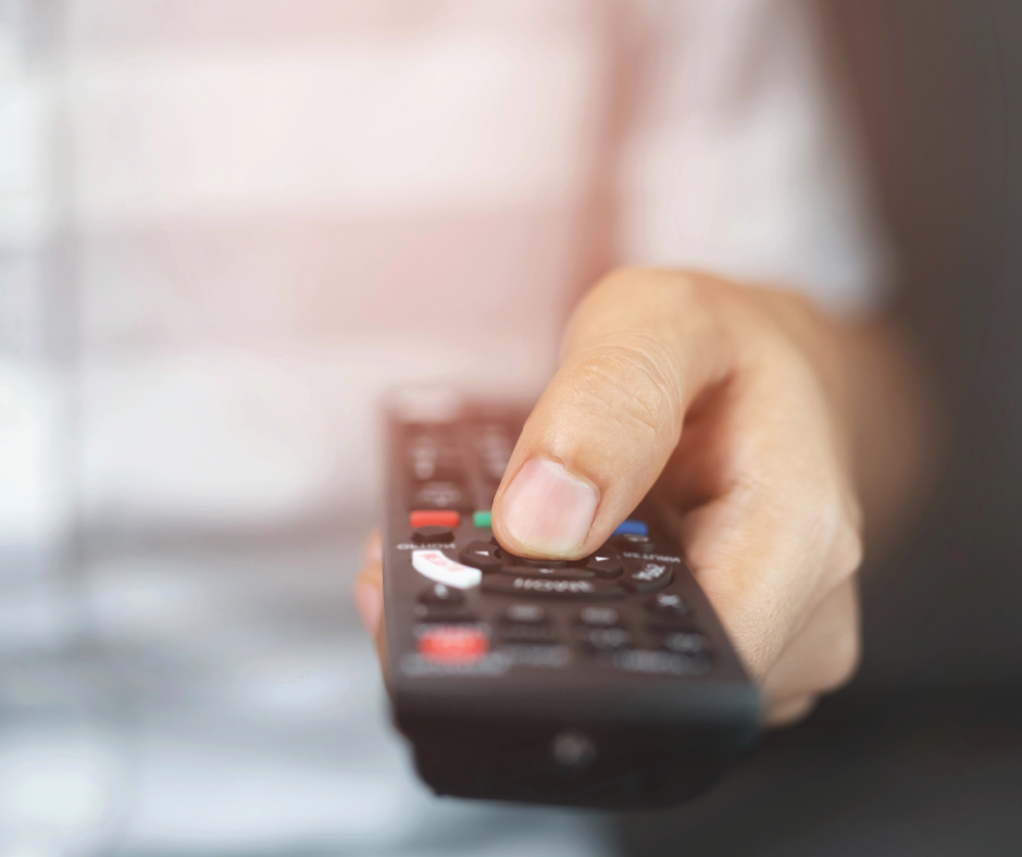 Person Holding Remote Person Holding Remote